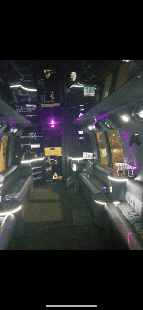 the inside of a limo with purple lighting.
