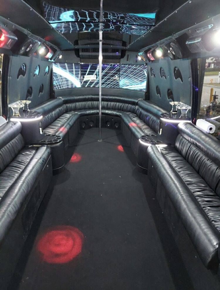 a party bus is decorated with black leather seats.