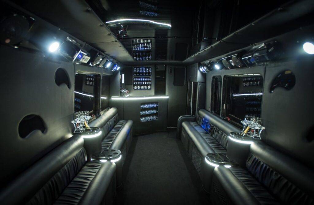 the interior of a party bus with lights on.