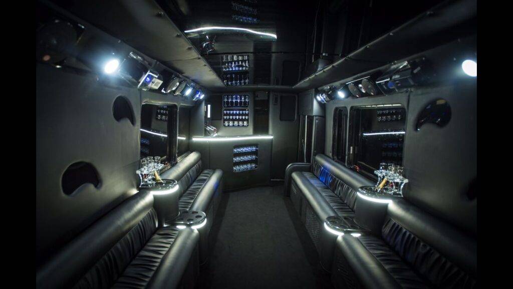 the interior of a bus with lights on.