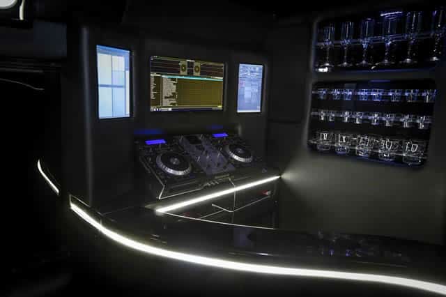 a control panel in a dark room with lights.